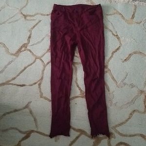 Distressed red skinny pants